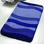 affordable wave patterned low pile bath rugs in blue, green or red