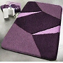 geometric bath rug design with multi dimensional pile height in red, green or purple