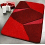 geometric bath rug design with multi dimensional pile height in red, green or purple